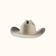 Beige cowboy hat on a white background
