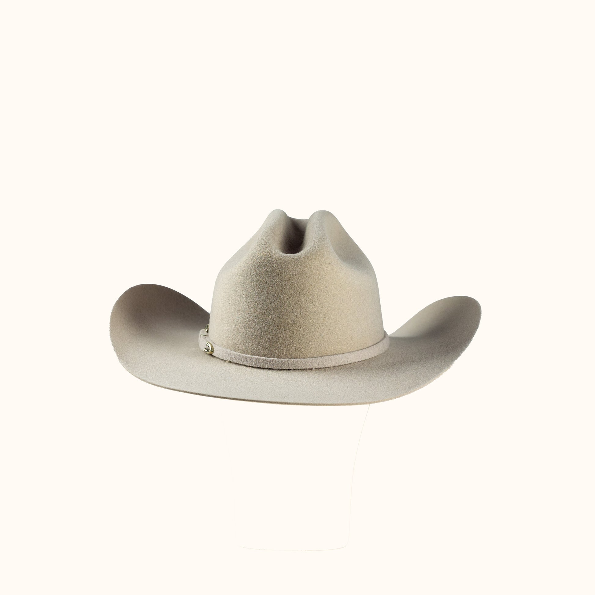 Beige cowboy hat on a white background