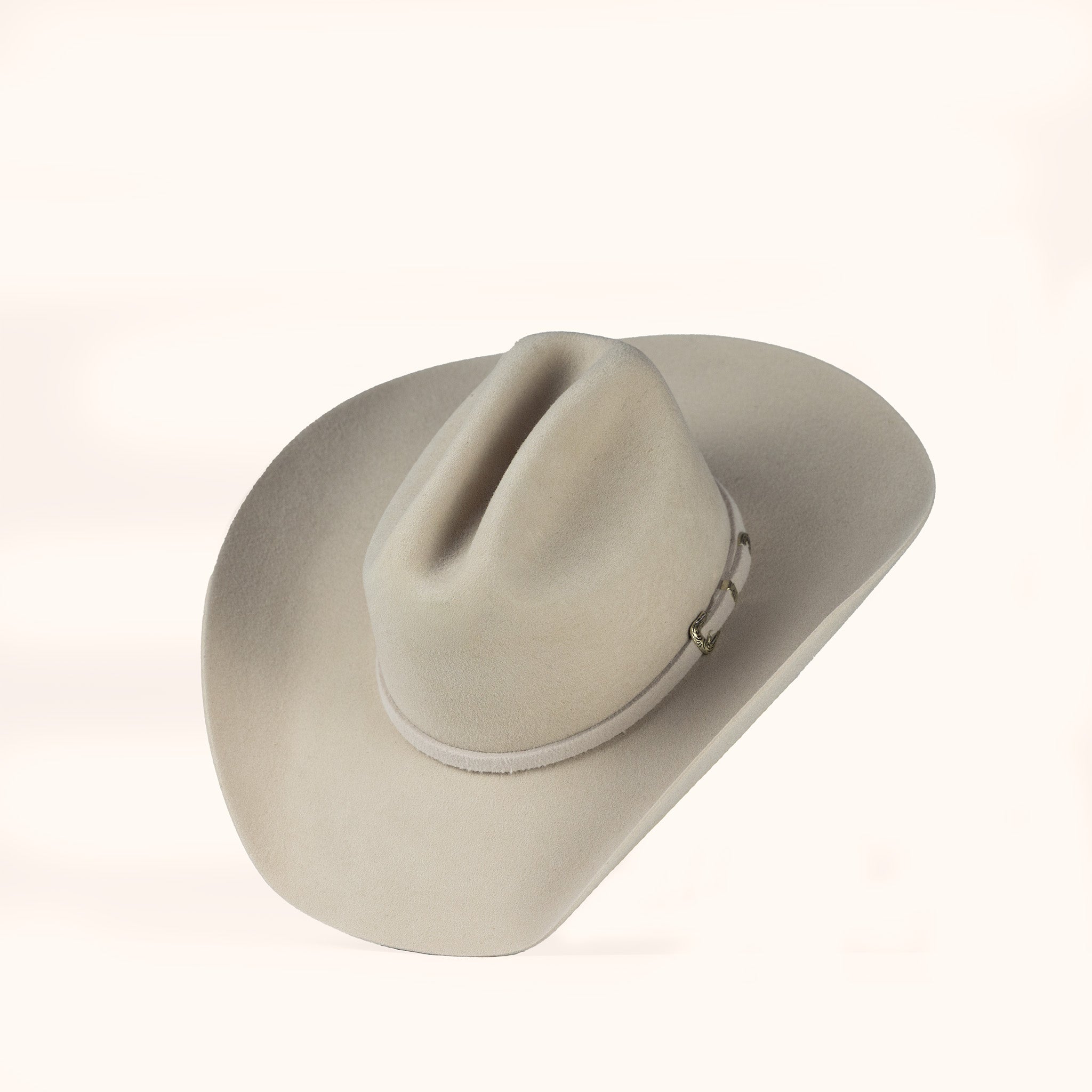Beige felt cowboy hat on a white background