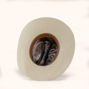 Beige cowboy hat with brown interior and leather sweatband on a white background