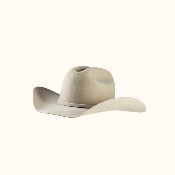 Beige cowboy hat on a white background