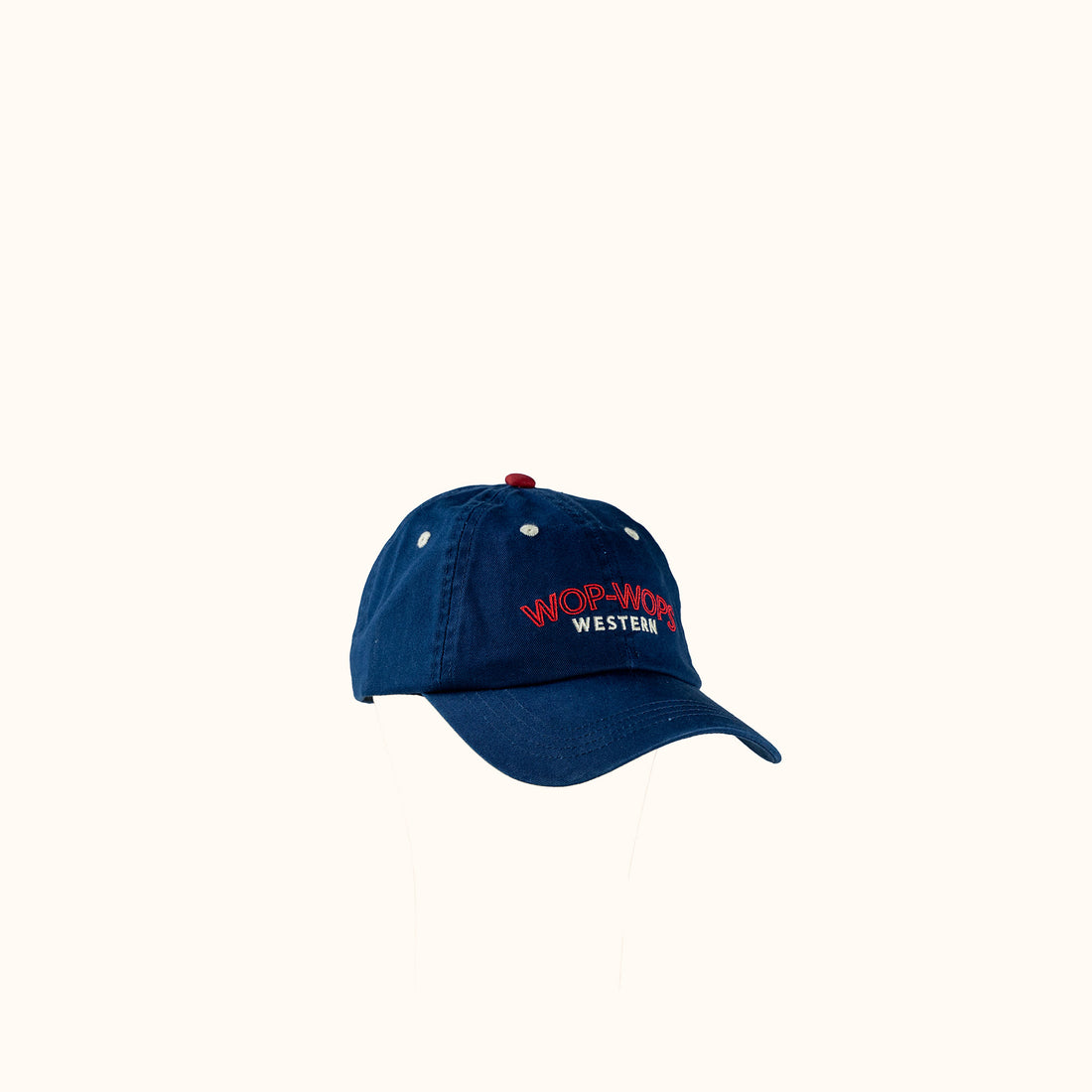 Blue cap with red and white Wop-Wops Western Logo on a white background