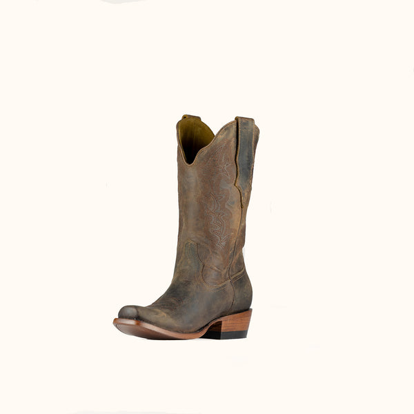 Brown leather cowboy boot on a white background